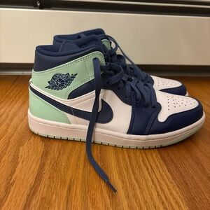 Blue and teal Nike Jordan’s Mids